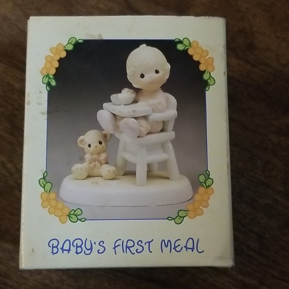 The Enesco Precious Moments Collection Baby's First Meal Figurine